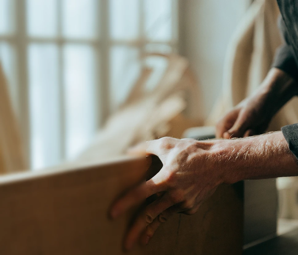 Man holding wooden plank